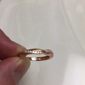Sterling silver ring with CZ’s, rose gold finish.
